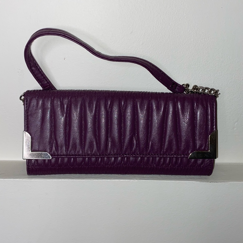A Rock and Candy purple with gold clutch.